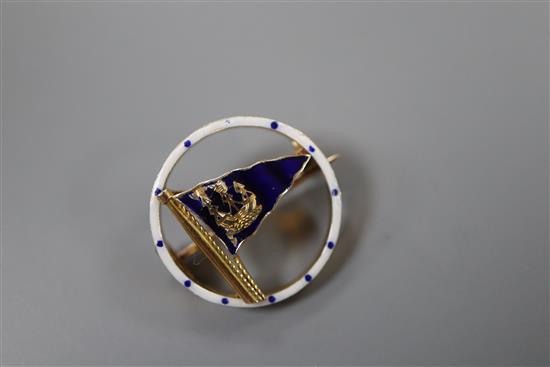 A 1950s 9ct gold and enamel set openwork circular pennant brooch, retailed by Benzies in Cowes, 22mm, gross 4.7 grams.